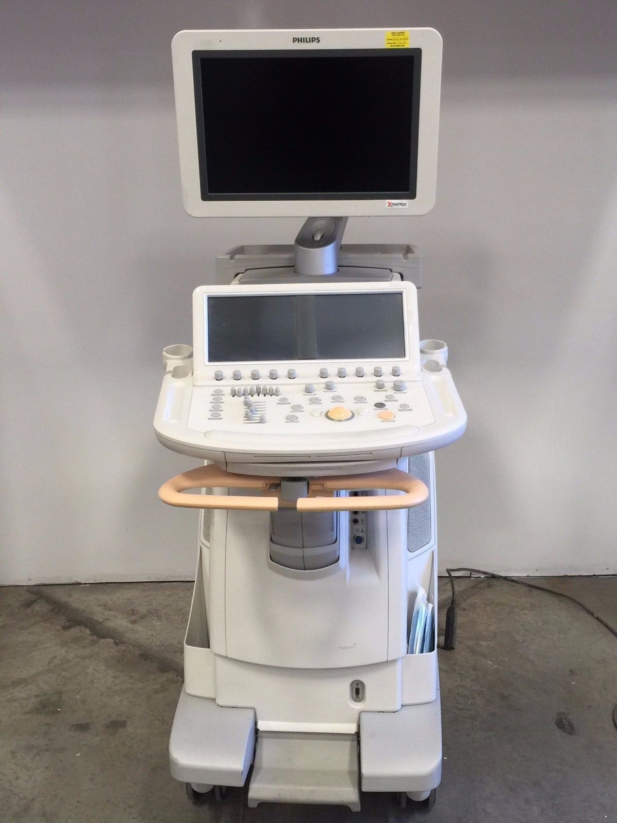 a medical machine with a monitor on top of it