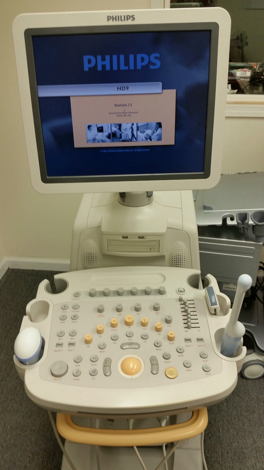 a computer monitor sitting on top of a hospital bed