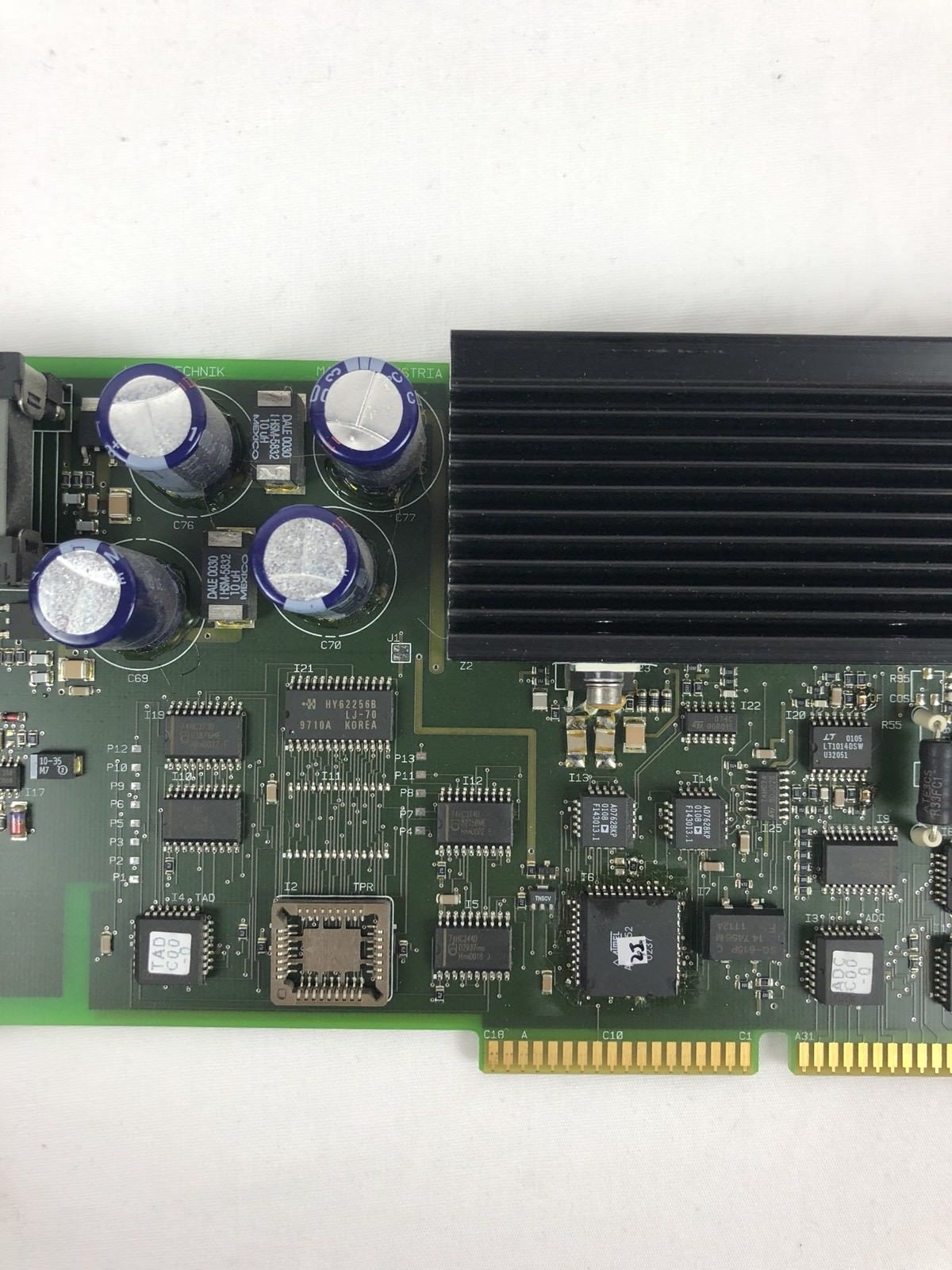 a close up of a computer motherboard on a white surface