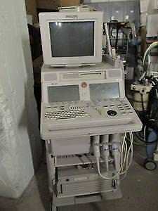 a computer sitting on top of a machine in a room