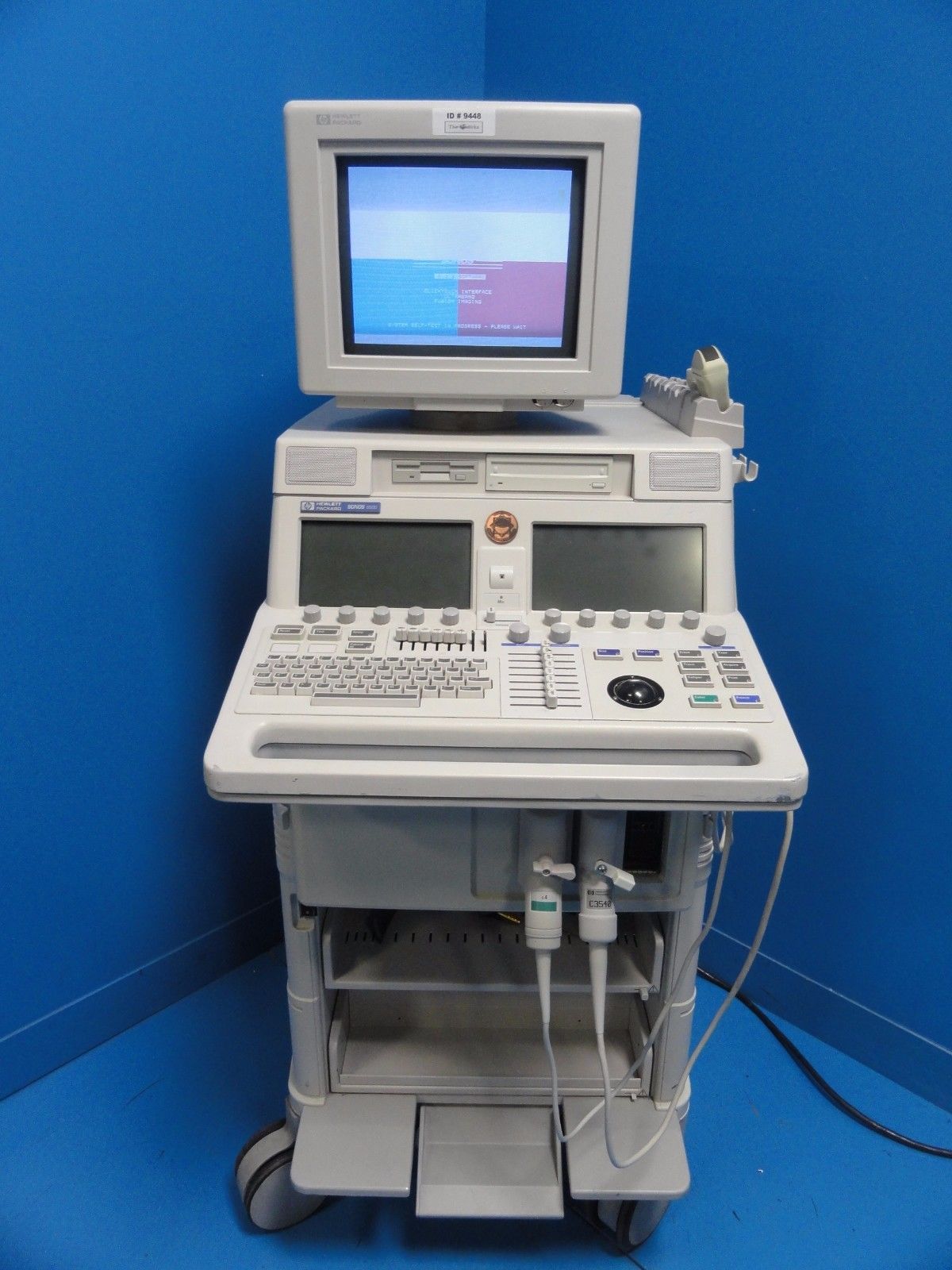 a medical machine with a monitor on top of it