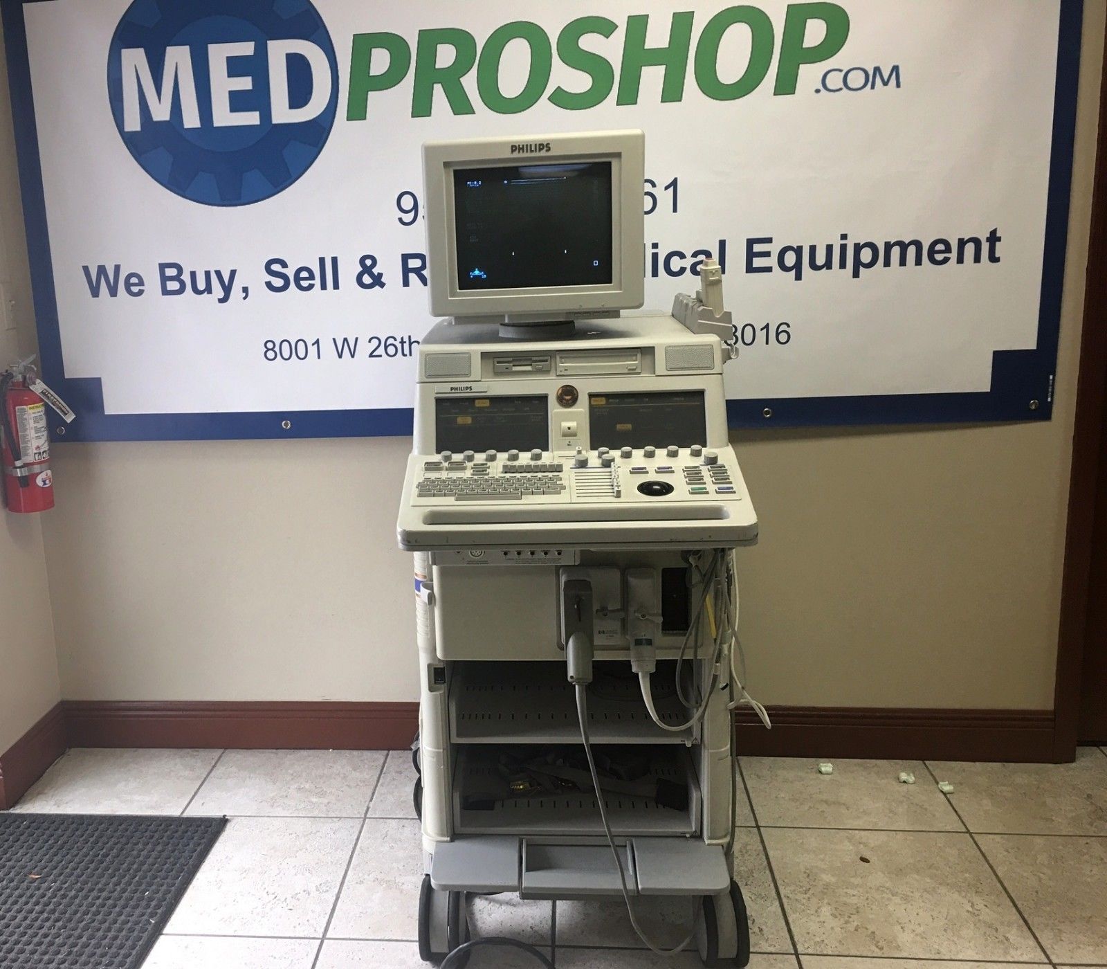 a medical equipment stand in front of a sign