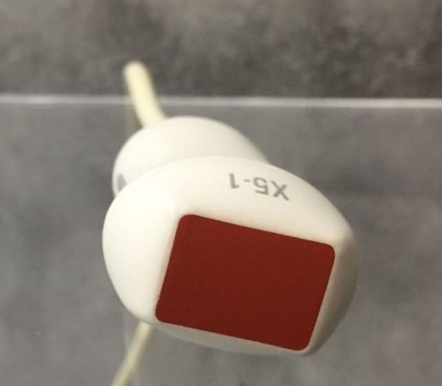 a close up red and white probe head