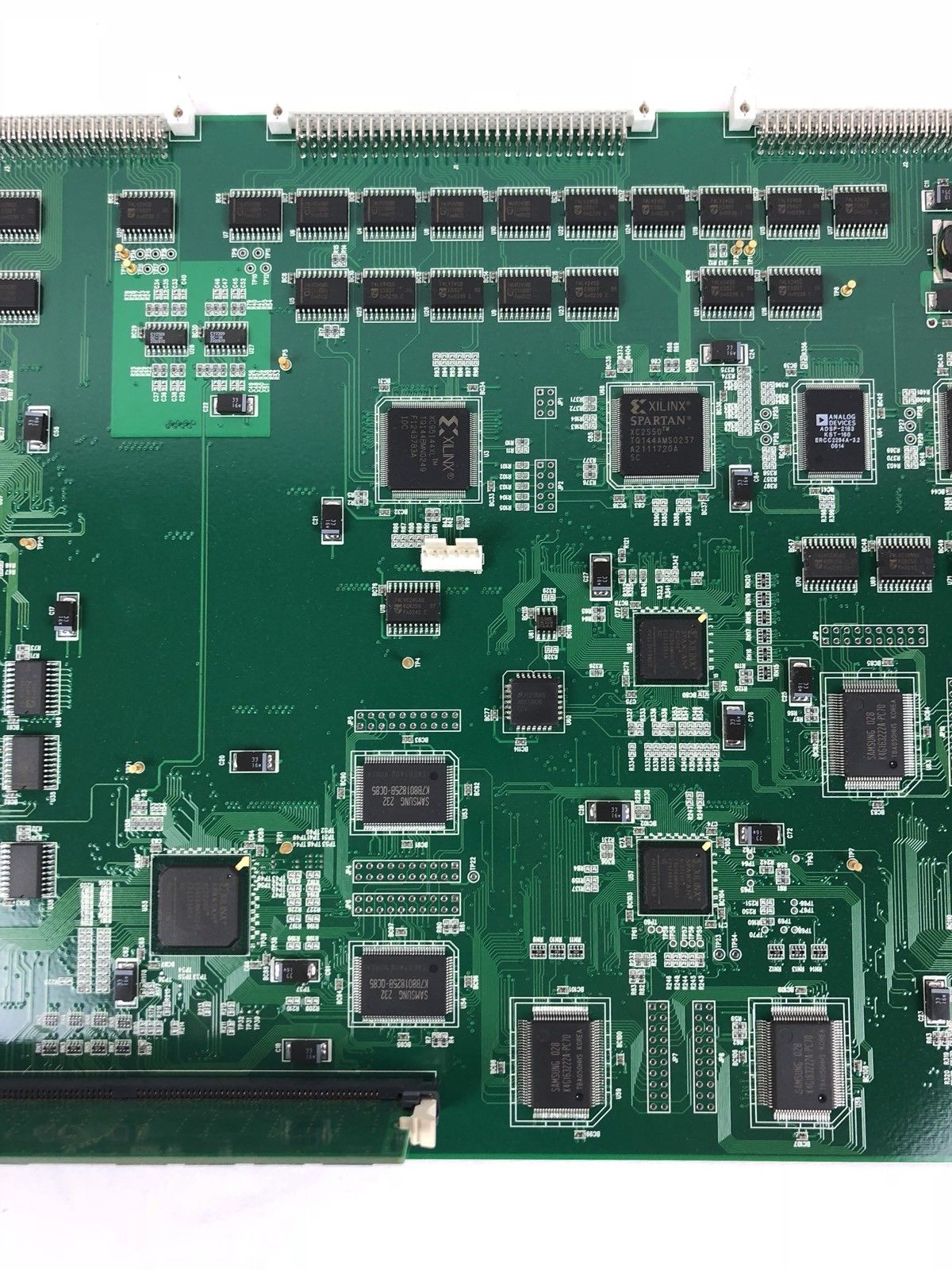 a close up of a green electronic board