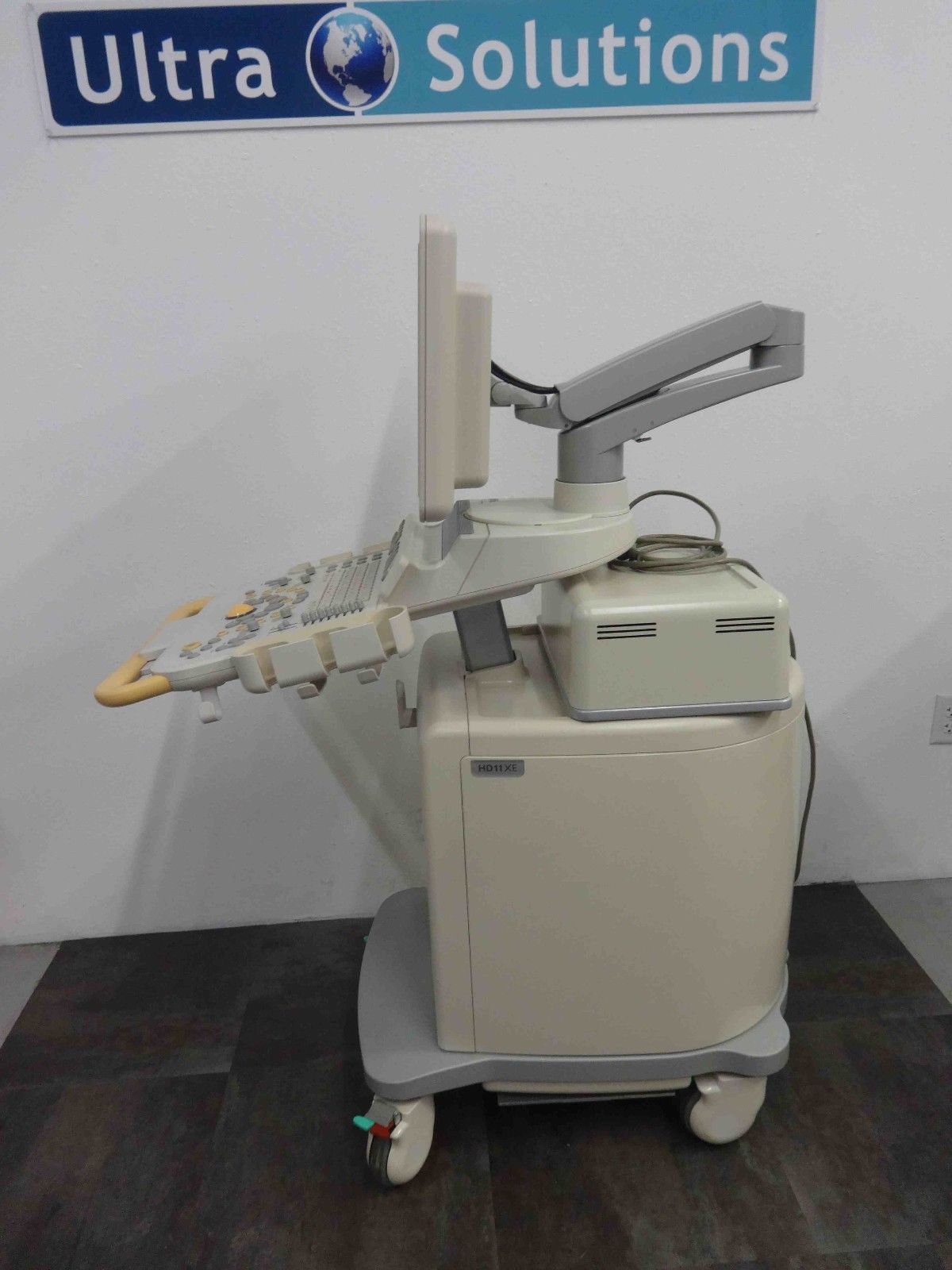 a medical device sitting on top of a wooden floor