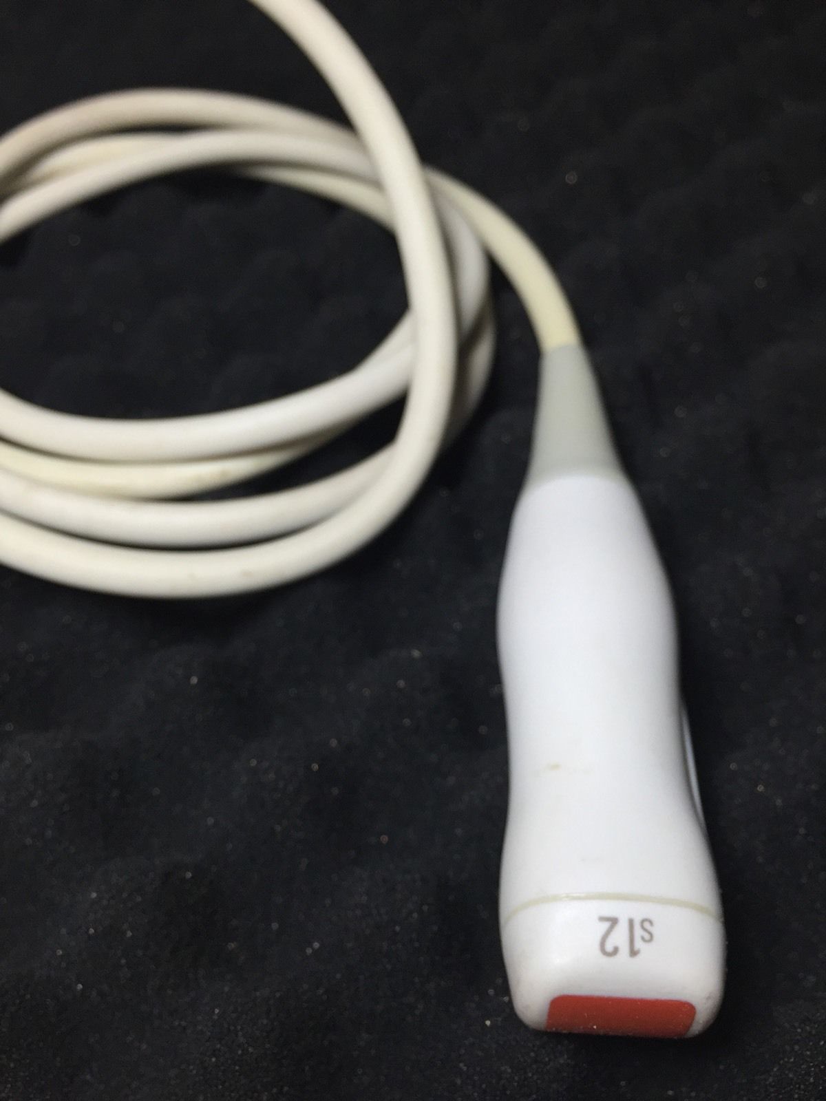 a close up of a cord connected to a device