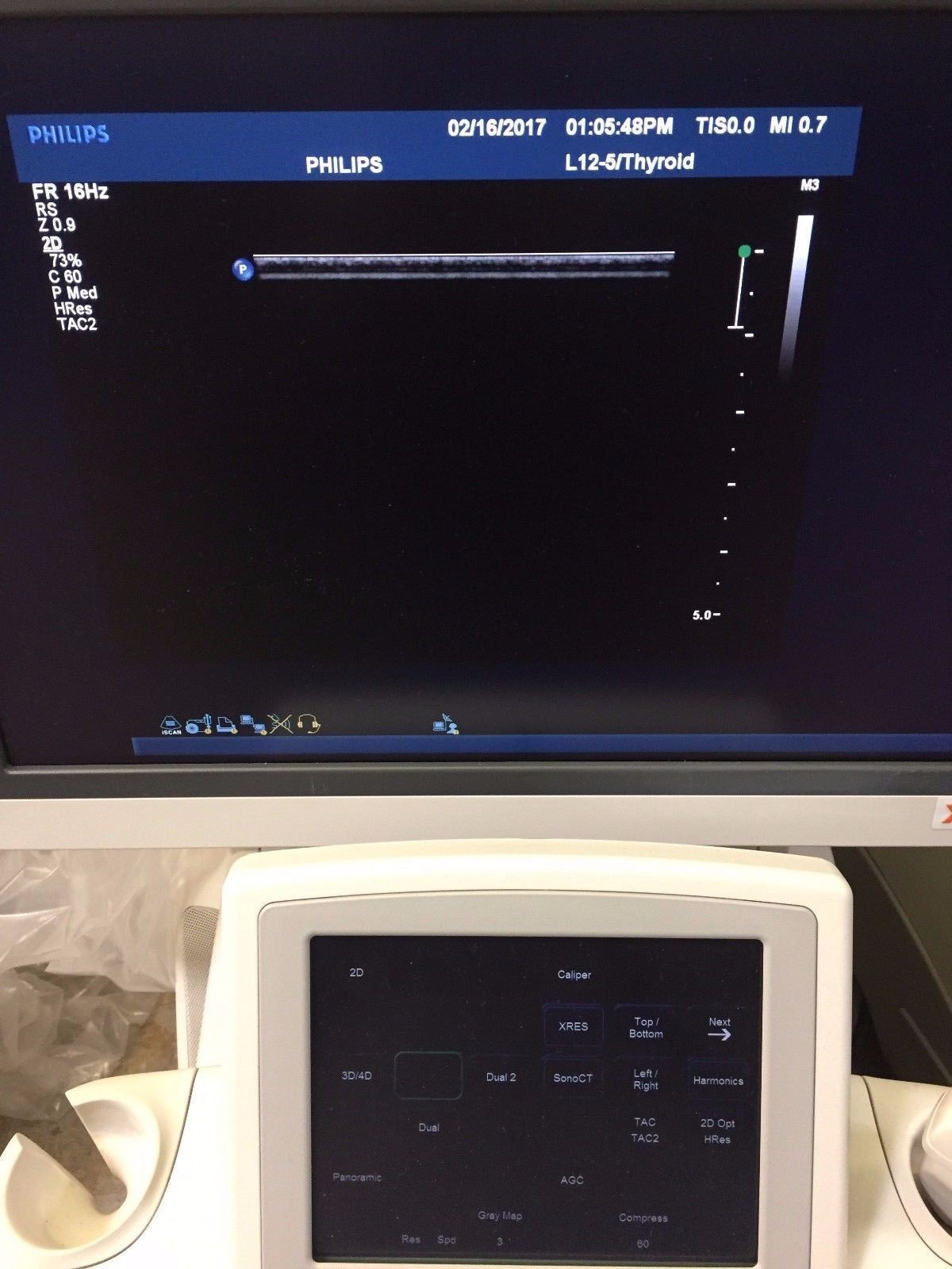 a computer monitor sitting on top of a desk