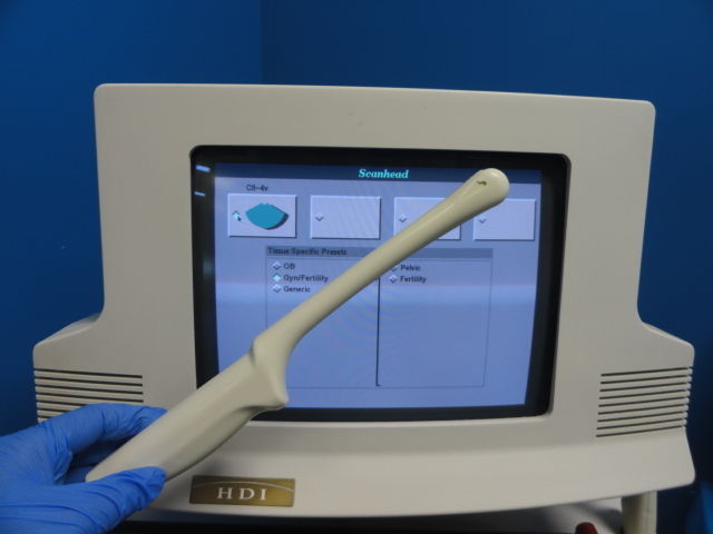 a person in blue gloves is using a computer