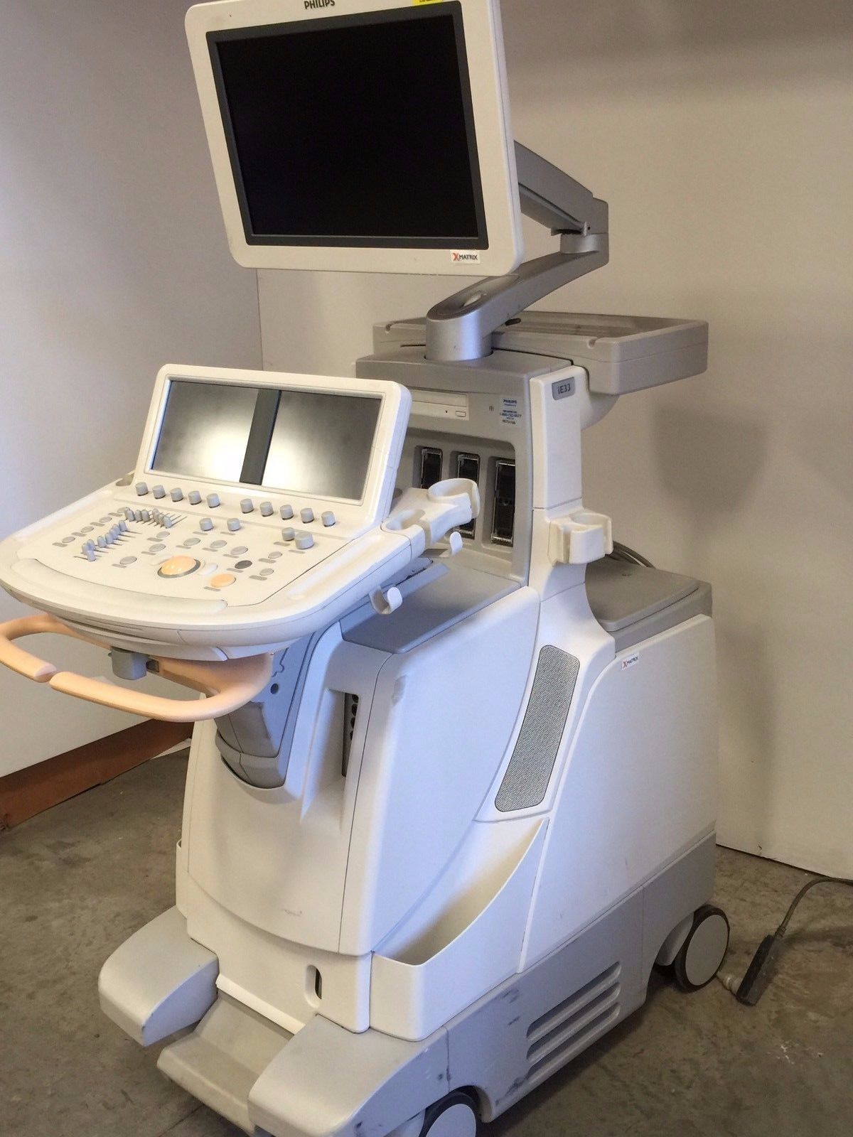 a medical machine with a monitor on top of it
