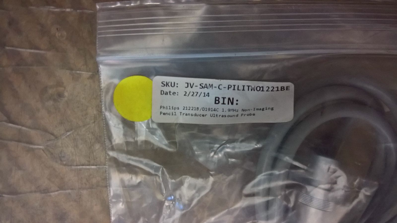 a yellow and white label on a plastic bag