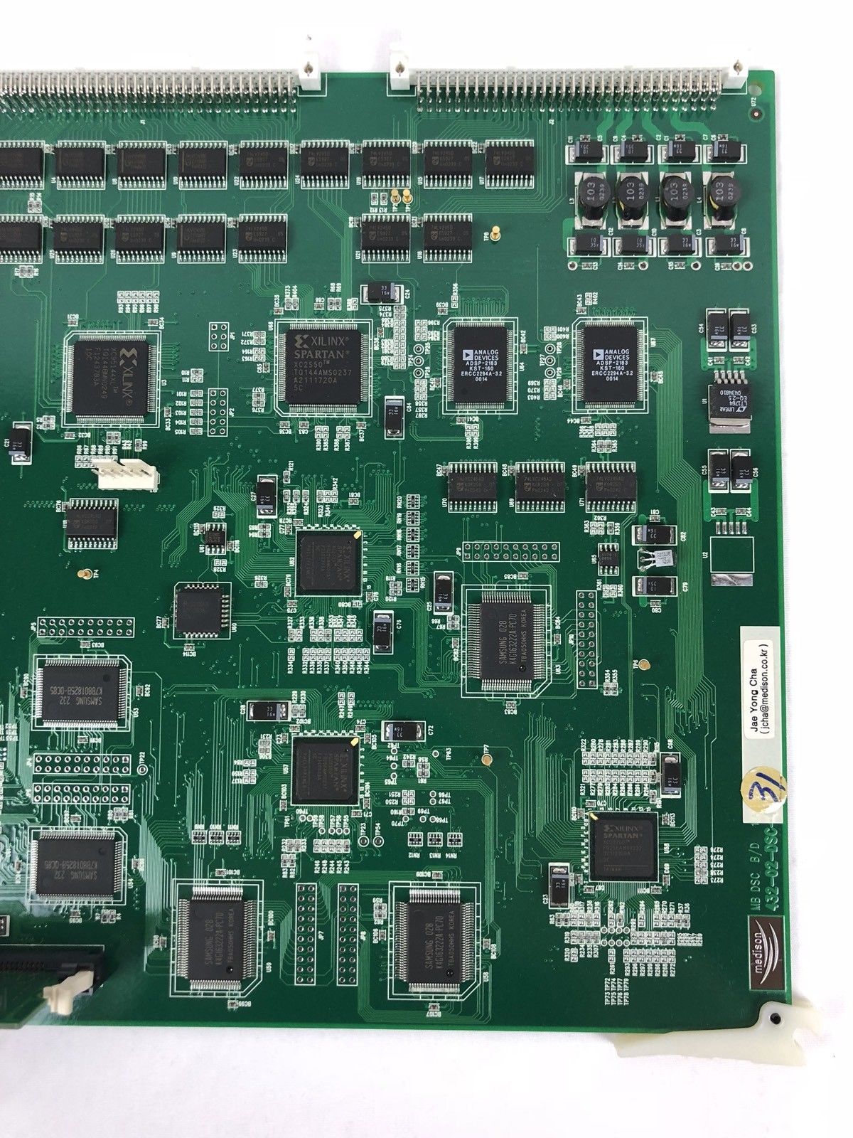 a close up of a green electronic board
